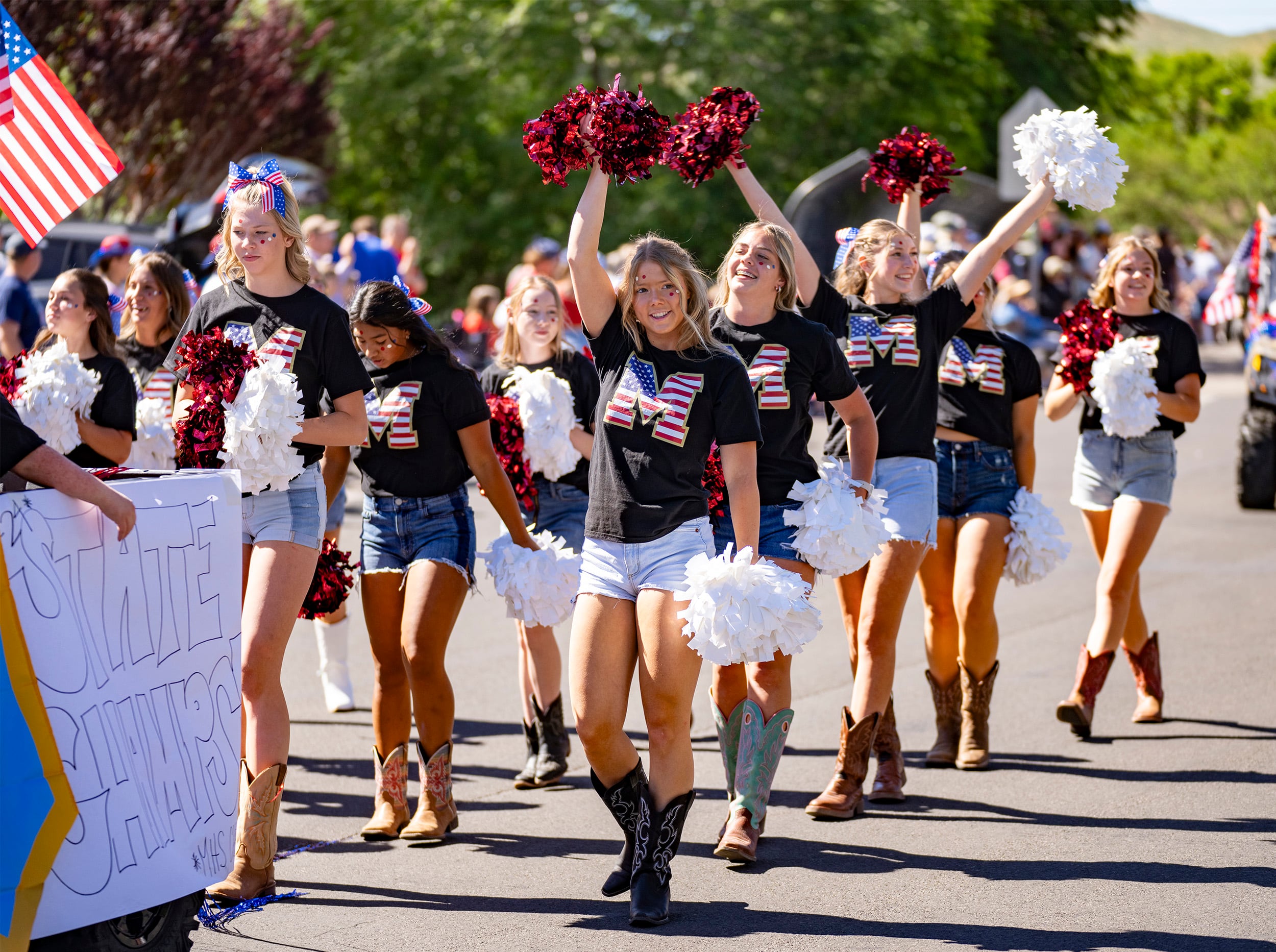 (Rick Egan | The Salt Lake Tribune) Morgan High cheerleaders perform in the Morgan parade on Thursday, July 4, 2024.
