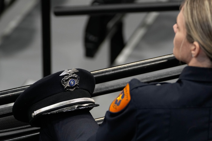 (Francisco Kjolseth  |  The Salt Lake Tribune) Police officers attend funeral services for Santaquin police Sgt. Bill Hooser at the UCCU Center at Utah Valley University on Monday, May 13, 2024.