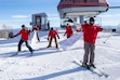 (Rick Egan | The Salt Lake Tribune)  The first skiers at Park City Mountain Resort go through the banner on Friday, Nov 22, 2024.

