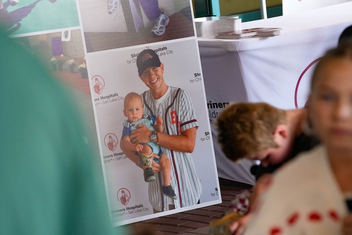 (Francisco Kjolseth  | The Salt Lake Tribune) Hunter Woodhall, a gold medalists in the Paris 2024 Games, is depicted holding Zach Adler when he was 1, as the Paralympian got a chance to visit Zach once more at the age on 8 on Wednesday, Sept. 18, 2024 at Shriners Children’s Hospital. Woodhall had his legs amputated when he was 11 months old and spent much of his youth at the hospital.