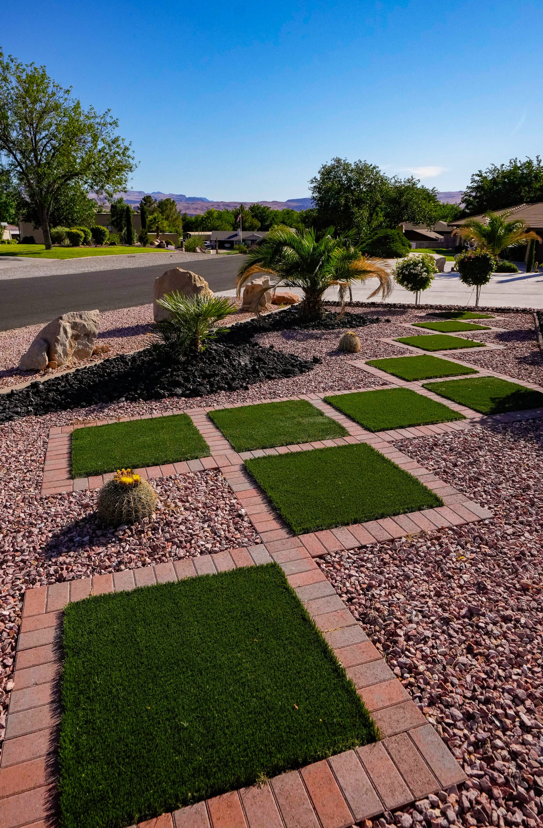 (Francisco Kjolseth | The Salt Lake Tribune) Retiree Ofelia Cortez, one of many St. George residents who has taken advantage of the Water Efficient Landscape Rebate was pleased with her results, pictured on Tuesday, June 11, 2024. She enjoys the savings from using less water and not having to pay a gardener to look after her lawn. 