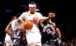 Utah Jazz guard Jordan Clarkson, front left, battles Brooklyn Nets guard Tyrese Martin (13) for the ball during the second half of an NBA basketball game, Saturday, Dec. 21, 2024, in New York. (AP Photo/Noah K. Murray)