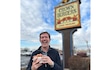 (Ali Vallarta) Bryant Heath stands in front of the Crown Burgers sign at the local chain's West Valley City location.