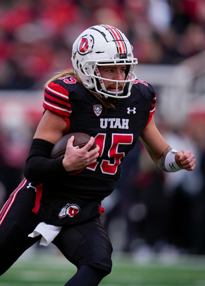 (Bethany Baker  |  The Salt Lake Tribune) Utah Utes quarterback Luke Bottari (15) runs the ball against the Colorado Buffaloes at Rice-Eccles Stadium in Salt Lake City on Saturday, Nov. 25, 2023.