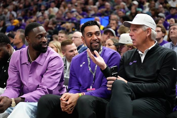 (Francisco Kjolseth  |  The Salt Lake Tribune) Utah Jazz minority owner Dwyane Wade, left, talks with Utah professional golfer Tony Finau and Utah Jazz executive Danny Ainge during NBA basketball in Salt Lake City on Wednesday, Oct. 25, 2023.