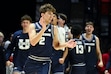 Utah State forward Tucker Anderson (2) celebrates after hitting a 3-point basket during the second half of an NCAA college basketball game against San Diego State, Saturday, Dec. 28, 2024, in San Diego. (AP Photo/Denis Poroy)