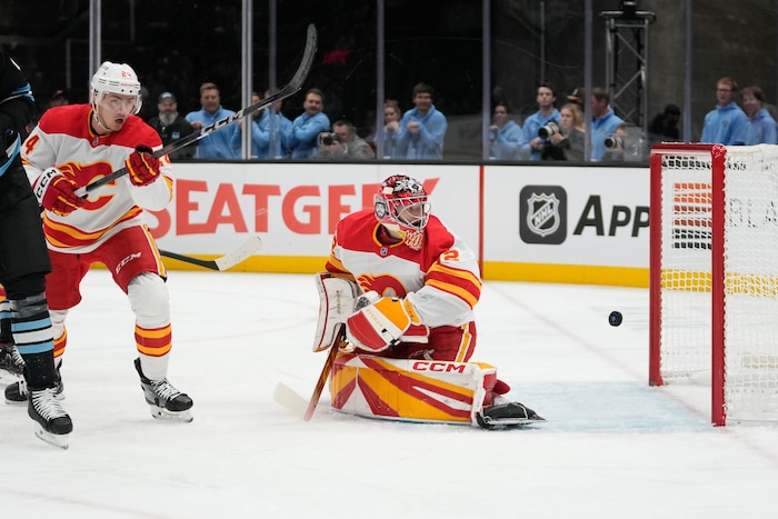 (Francisco Kjolseth  | The Salt Lake Tribune) Calgary Flames goaltender Dustin Wolf (32) lets one in as Utah Hockey Club scores their first gaol of the night during an NHL hockey game at the Delta Center in Salt Lake City on Wednesday, Oct. 30, 2024.