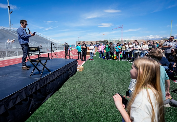 (Bethany Baker  |  The Salt Lake Tribune) Kevin Bacon prepares to take a video with the crowd following a charity event to commemorate the 40th anniversary of the movie "Footloose" on the football field of Payson High School in Payson on Saturday, April 20, 2024.