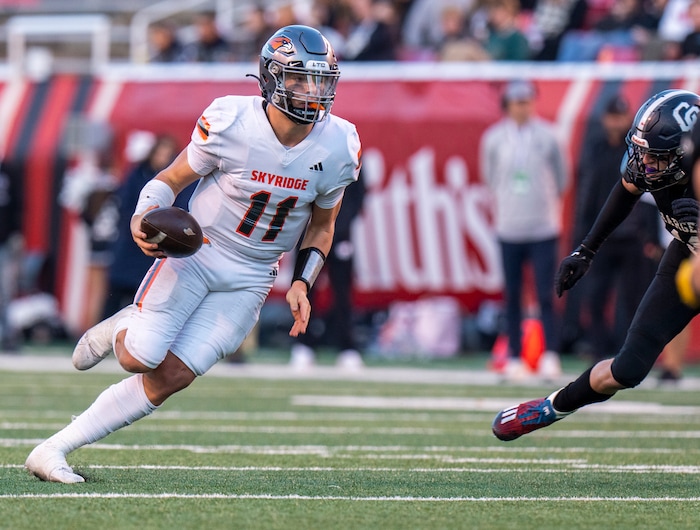 (Rick Egan | The Salt Lake Tribune)   Skyridge QB Jackson Stevens runs the ball, in 6A State playoff action between the Corner Canyon Chargers and the Skyridge Falcons, at Rice-Eccles Stadium, on Friday, Nov. 17, 2023.