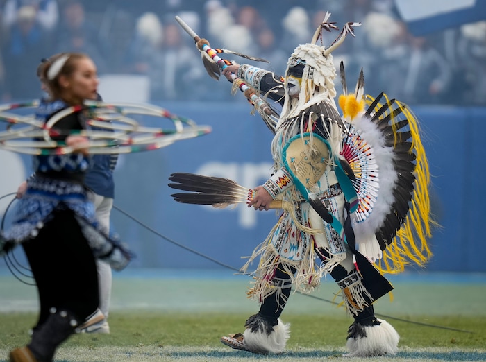 Performers dance during the game at LaVell Edwards Stadium in Provo on Saturday, Nov. 18, 2023.