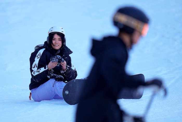 (Bethany Baker  |  The Salt Lake Tribune) Molly Blackham takes off her snowboard at Sundance Resort near Provo on Thursday, Dec. 14, 2023.