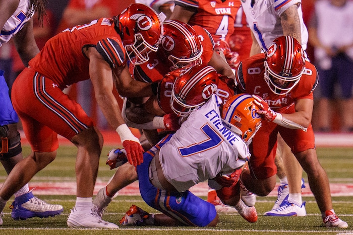 (Trent Nelson  |  The Salt Lake Tribune) Utah defenders bring down Florida Gators running back Trevor Etienne (7) as the Utah Utes host the Florida Gators, NCAA football in Salt Lake City on Thursday, Aug. 31, 2023.