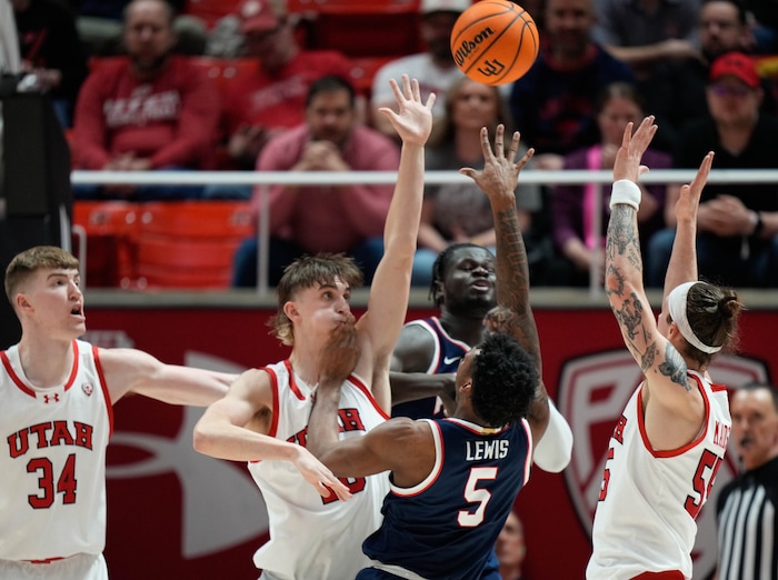 (Francisco Kjolseth  |  The Salt Lake Tribune) Arizona Wildcats guard KJ Lewis (5) pushes up against the Utah defense in PAC-12 basketball action between the Utah Utes and the Arizona Wildcats at the Jon M. Huntsman Center, on Thursday, Feb. 8, 2024.