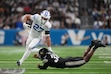 BYU running back LJ Martin (27) runs past Colorado linebacker Brendan Gant (38) during the first half of the Alamo Bowl NCAA college football game, Saturday, Dec. 28, 2024, in San Antonio. (AP Photo/Eric Gay)