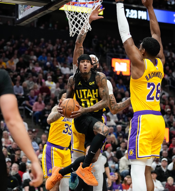 (Francisco Kjolseth  |  The Salt Lake Tribune) Utah Jazz guard Jordan Clarkson (00) redirects the ball to a teammate pas the Lakers defense during an NBA basketball game Wednesday, Feb. 14, 2024, in Salt Lake City.