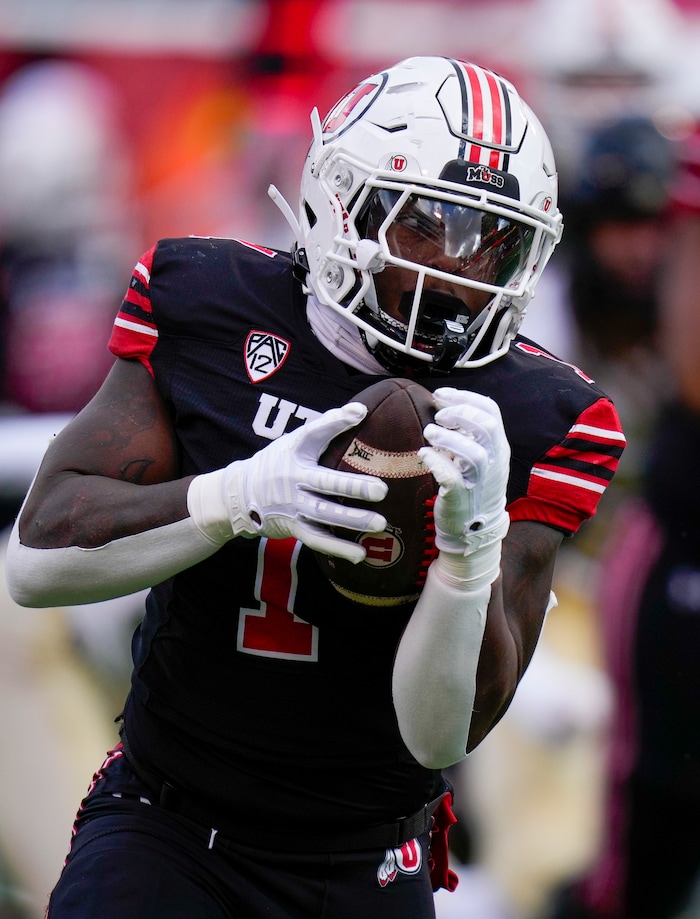 (Bethany Baker  |  The Salt Lake Tribune) Utah Utes running back Jaylon Glover (1) runs the ball against the Colorado Buffaloes at Rice-Eccles Stadium in Salt Lake City on Saturday, Nov. 25, 2023.