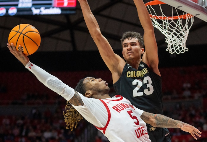 (Rick Egan | The Salt Lake Tribune) Utah Utes guard Deivon Smith (5) shoots as Colorado Buffaloes forward Tristan da Silva (23) defends, in PAC-12 basketball action between the Utah Utes and the Colorado Buffaloes a the Jon M. Huntsman Center, on Saturday, Feb. 3, 2024.
