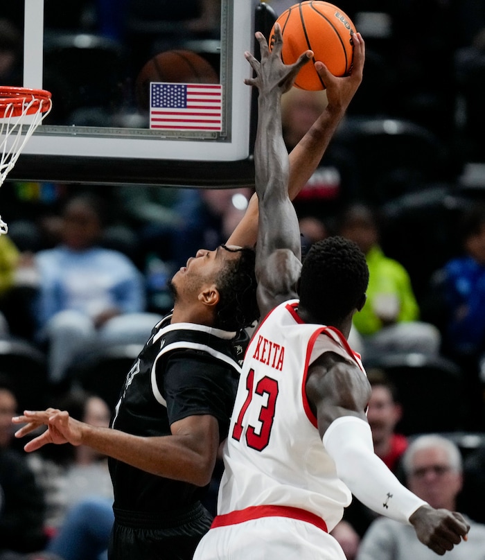 (Bethany Baker  |  The Salt Lake Tribune) Utah Utes center Keba Keita (13) tries to block a shot by Hawaii Warriors forward Bernardo da Silva (5) at the Delta Center in Salt Lake City on Thursday, Nov. 30, 2023.
