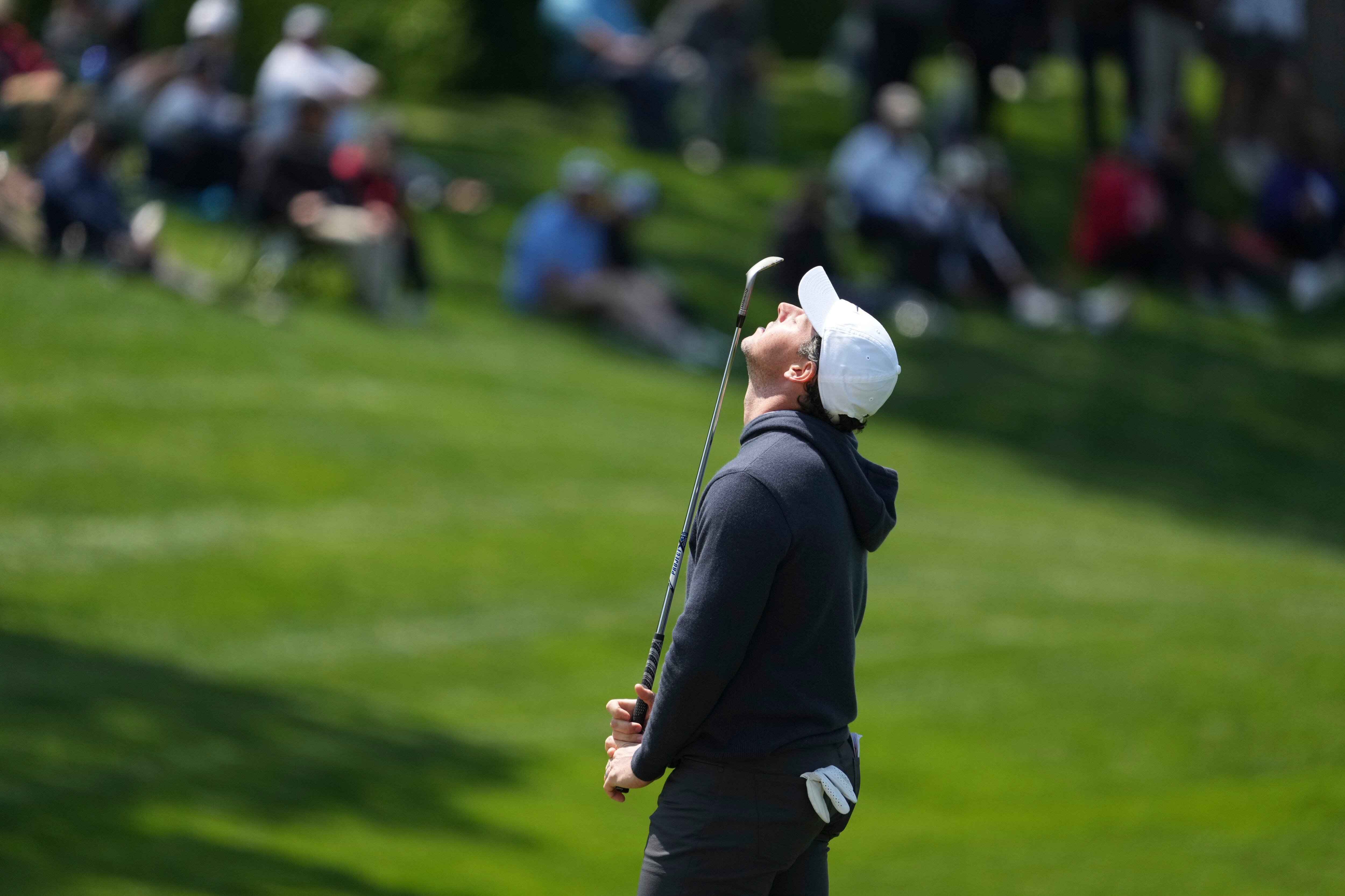 (Desiree Rios | The New York Times) Rory McIlroy reacts after missing a shot on the 2nd hole during the first round of the 2023 PGA Championship at Oak Hill Country Club in Rochester, N.Y., May 18, 2023. Birdies were at a premium for many of the 156 golfers vying for the Wanamaker Trophy at Oak Hill Country Club during the first round of the major tournament on Thursday, May 18, 2023.