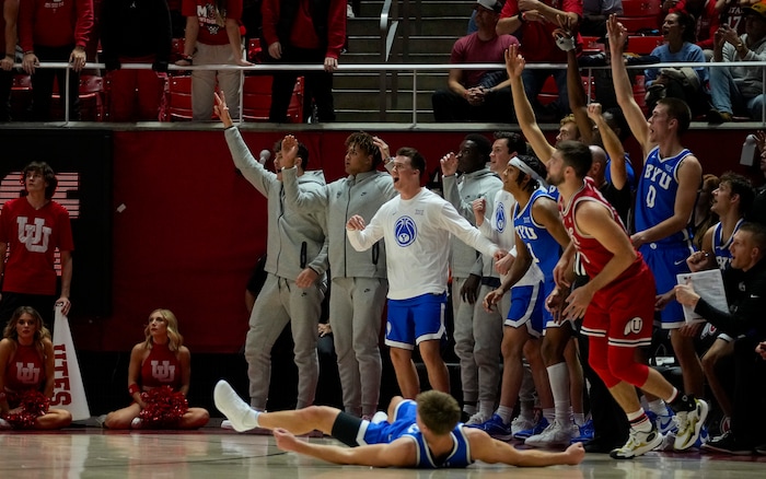 (Bethany Baker  |  The Salt Lake Tribune) Brigham Young Cougars react after Utah Utes guard Rollie Worster (25) fouls Brigham Young Cougars guard Dallin Hall (30) at the Jon M. Huntsman Center in Salt Lake City on Saturday, Dec. 9, 2023.