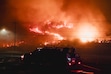 (Mark Abramson | The New York Times) Flames burn Pacific Palisades along the Pacific Coast Highway adjacent to the ocean at the Pacific Palisades fire in Los Angeles, Jan. 7, 2025. The Church of Jesus Christ of Latter-day Saints has opened it bishops' storehouses and other facilities to the thousands impacted by the fires still burning in eastern and western Los Angeles County.