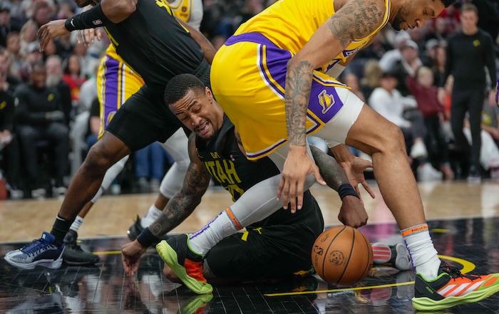 (Francisco Kjolseth  |  The Salt Lake Tribune) Utah Jazz forward John Collins (20) battles for a ball against the Lakers during an NBA basketball game Wednesday, Feb. 14, 2024, in Salt Lake City.