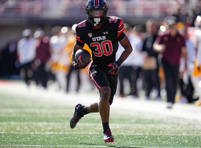 (Francisco Kjolseth  |  The Salt Lake Tribune) Utah Utes running back Dijon Stanley (30) puts down yards as the Utah Utes host the Arizona State Sun Devils in NCAA football in Salt Lake City on Saturday, Nov. 4, 2023.