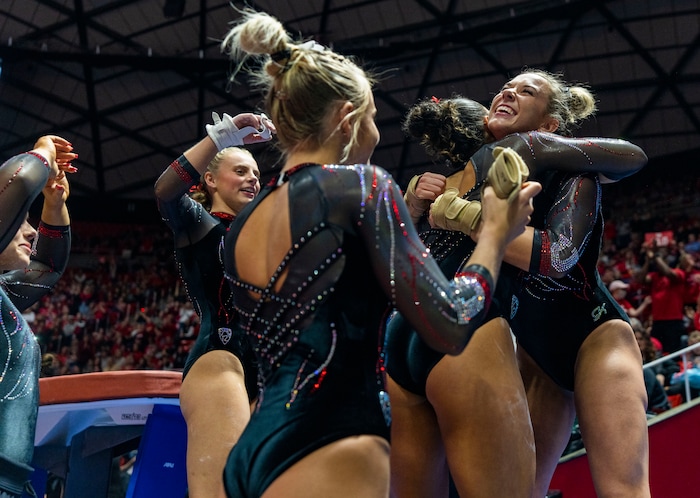 (Rick Egan | The Salt Lake Tribune)  Jaylene Gilstrap gets hugs after her vault, in gymnastics action between Utah  Red Rocks and Oregon State, at the Jon M. Huntsman Center, on Friday, Feb. 2, 2024.
