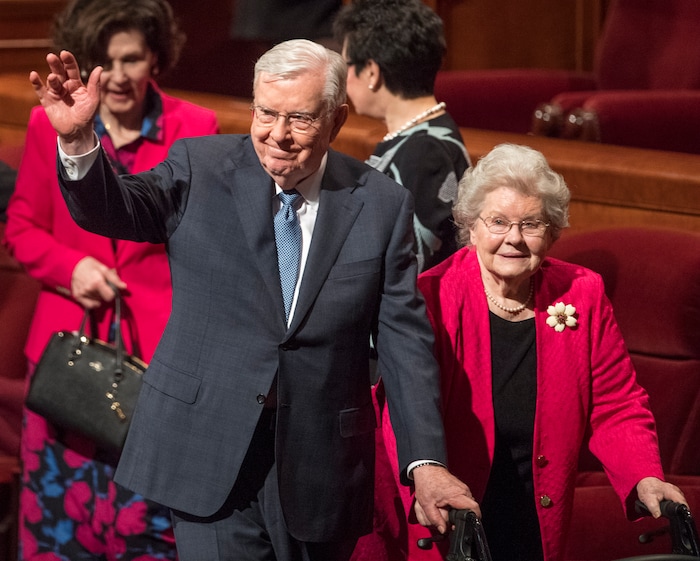 (Rick Egan | The Salt Lake Tribune) Apostle M. Russell Ballard waves as he leaves the stand with his wife, Barbara Ballard, after the Saturday morning session of the 188th Annual General Conference in Salt Lake City in March 2018.