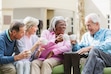 (Getty Images, Sponsored) Multi-ethnic group of senior adult friends enjoys visiting together