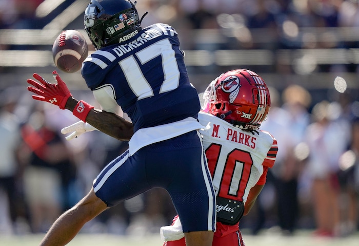 (Francisco Kjolseth  | The Salt Lake Tribune) Utah State Aggies cornerback Avante Dickerson (17) breaks up a pass intended for Utah Utes wide receiver Money Parks (10) as Utah State hosts the University of Utah during the first half of an NCAA college football game Saturday, Sept. 14, 2024, in Logan, Utah.