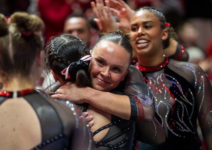 (Rick Egan | The Salt Lake Tribune)  Maile O'Keefe gets hug form a team mate after scoring a 10 on the beam, in gymnastics action between Utah  Red Rocks and Oregon State, at the Jon M. Huntsman Center, on Friday, Feb. 2, 2024.
