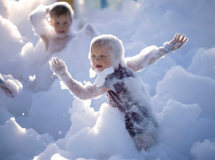 (Rick Egan | The Salt Lake Tribune)  Six-year-old Birkland dances in the bubbles at the Fork Fest in American Fork, on Saturday, June 17, 2023.
