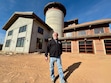 (Mark Eddington | The Salt Lake Tribune) Rick Salisbury standing in front of the St. George Strap Tank on Monday, Dec. 23, 2024, which is under construction and is scheduled to open in March.