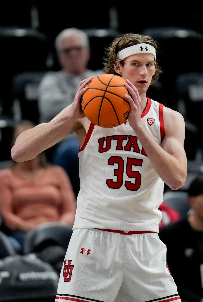 (Bethany Baker  |  The Salt Lake Tribune) Utah Utes center Branden Carlson (35) holds a rebound during the game against the Hawaii Warriors at the Delta Center in Salt Lake City on Thursday, Nov. 30, 2023.
