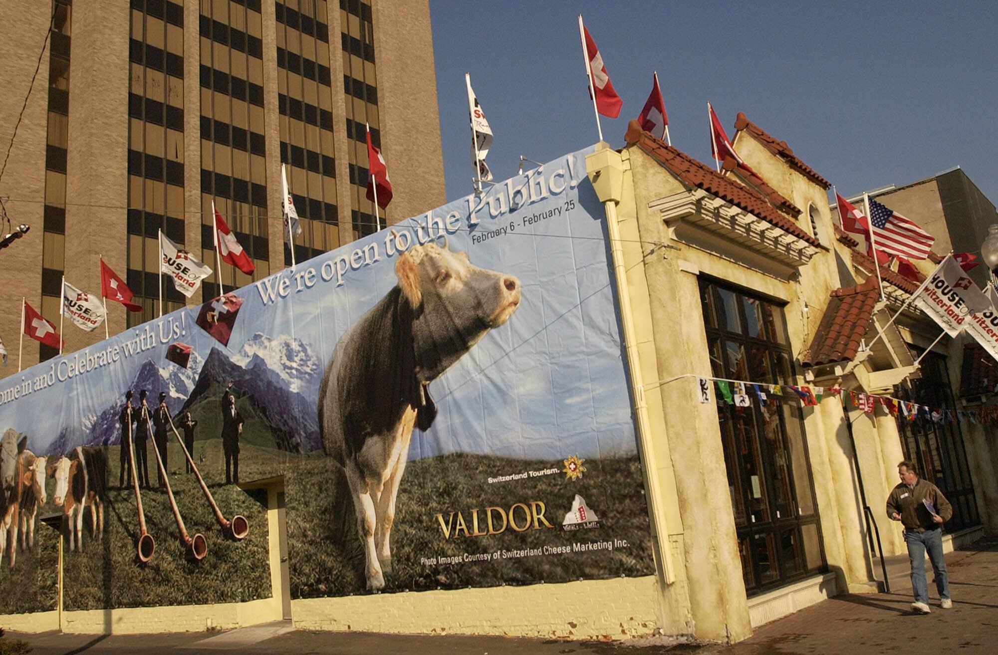 (Francisco Kjolseth | The Salt Lake Tribune) The Swiss hospitality house along Market Street in Salt Lake City greets visitors on one side with a large mural of cows ahead of the 2002 Winter Olympics, Feb. 5, 2002. Various national houses and centers were leased in the area during the Games.