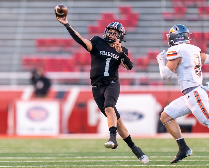 (Rick Egan | The Salt Lake Tribune) Corner Canyon QB Isaac Wilson (1), passes for the Chargers in their 6A High School State championship win over the Skyridge Falcons, at Rice-Eccles Stadium, on Friday, Nov. 17, 2023.