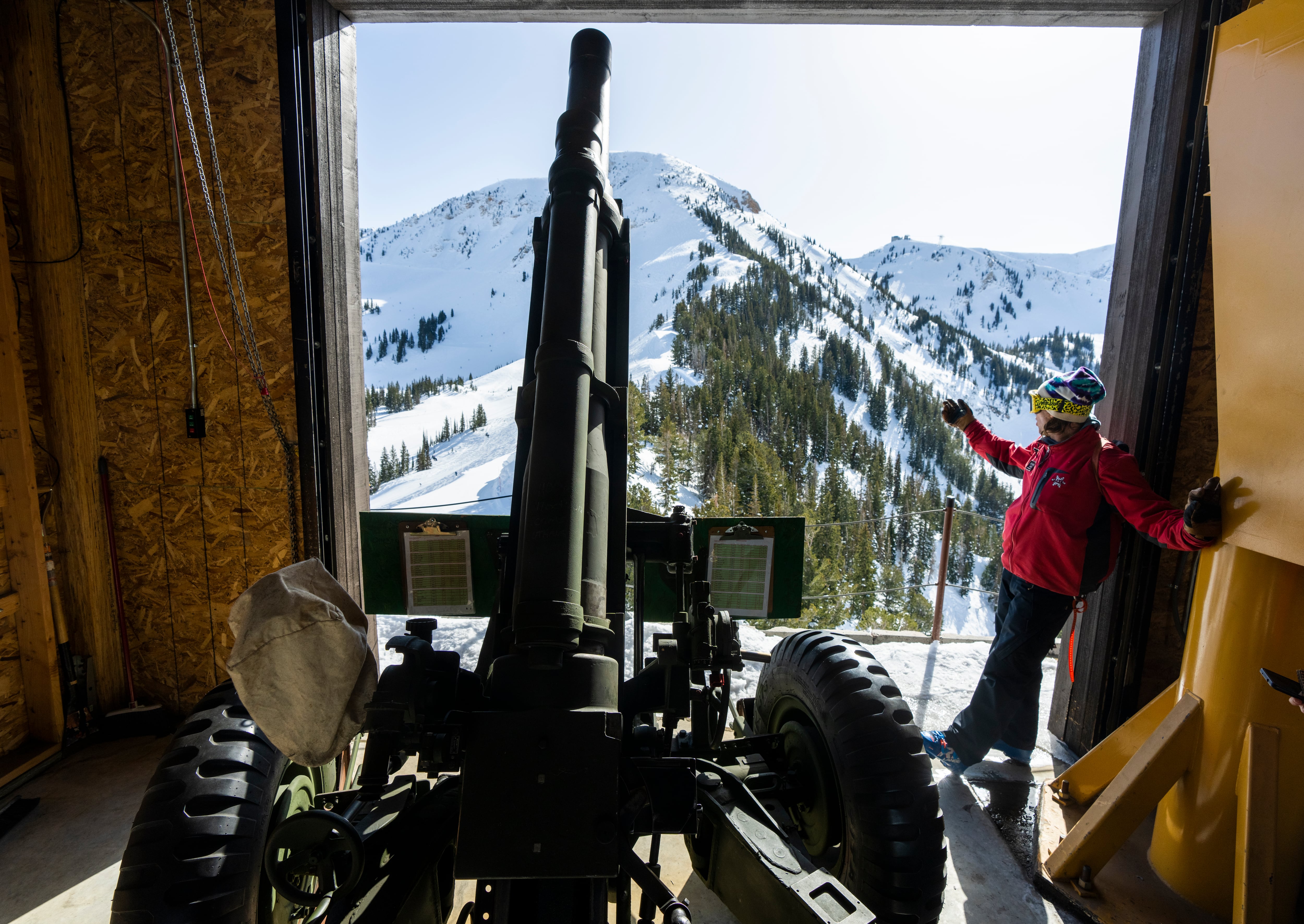 (Rick Egan | The Salt Lake Tribune) Jaybee Keller, Alta Ski Patrol, explains how the Howitzers are being used for avalanche mitigation at Alta, on Saturday, Feb. 4, 2023.
