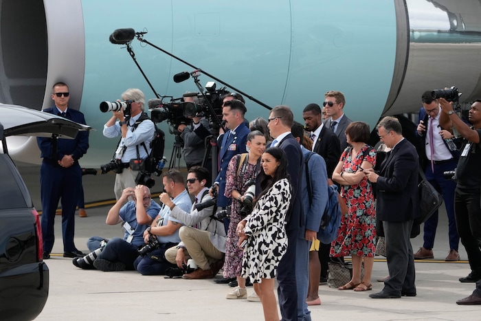 (Francisco Kjolseth | The Salt Lake Tribune) The press pool documents the arrive of President Joe Biden aboard Air Force One after landing at Roland R. Wright Air National Guard Base in Utah on Wednesday, Aug. 9, 2023.