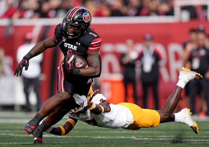 (Francisco Kjolseth  |  The Salt Lake Tribune) Utah Utes running back Jaylon Glover (1) pushes past Arizona State Sun Devils defensive back Shamari Simmons as the Utah Utes host the Arizona State Sun Devils in NCAA football in Salt Lake City on Saturday, Nov. 4, 2023.