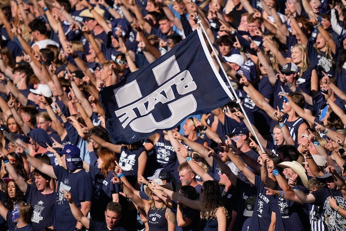 (Francisco Kjolseth  | The Salt Lake Tribune) Aggie fans cheer on the their team Utah State hosts the University of Utah during the second half of an NCAA college football game Saturday, Sept. 14, 2024, in Logan, Utah.