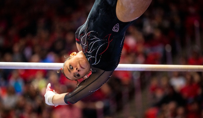 (Rick Egan | The Salt Lake Tribune)  Amelie Morgan performs on the bars, in gymnastics action between Utah Red Rocks and Oregon State, at the Jon M. Huntsman Center, on Friday, Feb. 2, 2024.
