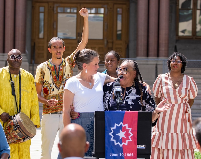 (Rick Egan | The Salt Lake Tribune)  Salt Lake Mayor Erin Mendenhall hugs Betty Sawyer as she says a few words at City Hall during a flag-raising ceremony Monday, June 19, 2023.
