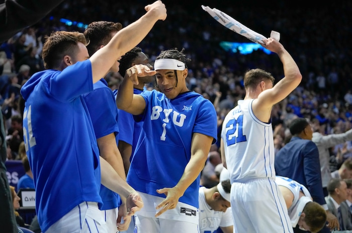 (Francisco Kjolseth  |  The Salt Lake Tribune) The BYU bench goes wild as the team makes up an early deficit to take down TCU  87-75 during an NCAA college basketball game against TCU Saturday, March 2, 2024, in Provo, Utah.