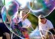 (Francisco Kjolseth  |  The Salt Lake Tribune) Kids play with soap bubbles as they join the celebration for the 20th anniversary of World Refugee Day at Big Cottonwood Park on Friday, June 21, 2024. Utah is still the youngest state in the nation, but there were fewer young children last year than in 2022 and a decade ago.