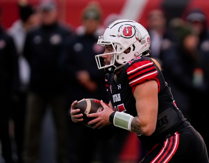 (Bethany Baker  |  The Salt Lake Tribune) Utah Utes quarterback Luke Bottari (15) runs the ball against the Colorado Buffaloes at Rice-Eccles Stadium in Salt Lake City on Saturday, Nov. 25, 2023.