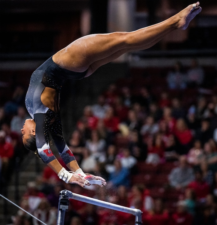 (Rick Egan | The Salt Lake Tribune)  f Amelie Morgan performs on the bars for Utah, during a meet between Utah, LSU, Oklahoma and UCLA at the Maverik Center, on Saturday, Jan. 13, 2024.
