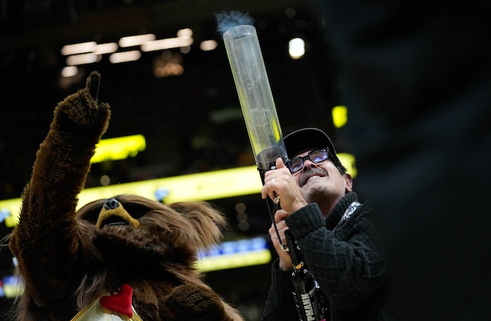 (Francisco Kjolseth  |  The Salt Lake Tribune) Actor Ty Burrell gets a chance to shoot a t-shirt into the stands with the help of the Jazz Bear during an NBA basketball game against the Lakers on Wednesday, Feb. 14, 2024, in Salt Lake City.