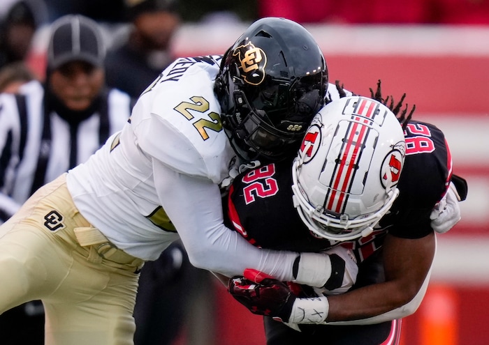 (Bethany Baker  |  The Salt Lake Tribune) Colorado Buffaloes linebacker Demouy Kennedy (22) tackles Utah Utes tight end Landen King (82) at Rice-Eccles Stadium in Salt Lake City on Saturday, Nov. 25, 2023.