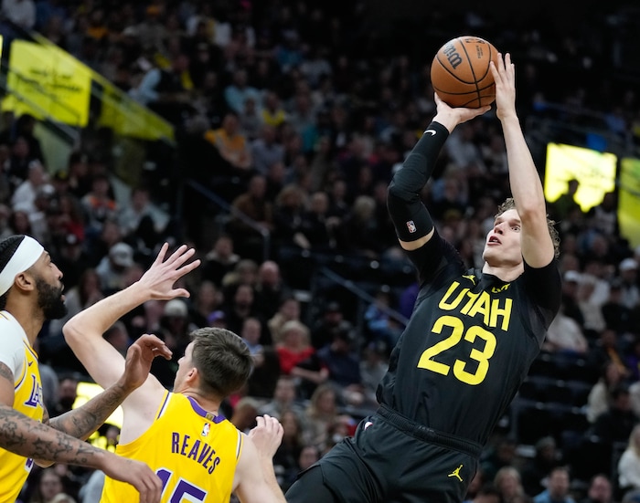 (Francisco Kjolseth  |  The Salt Lake Tribune) Utah Jazz forward Lauri Markkanen (23) shoots over the Lakers defense during an NBA basketball game Wednesday, Feb. 14, 2024, in Salt Lake City.